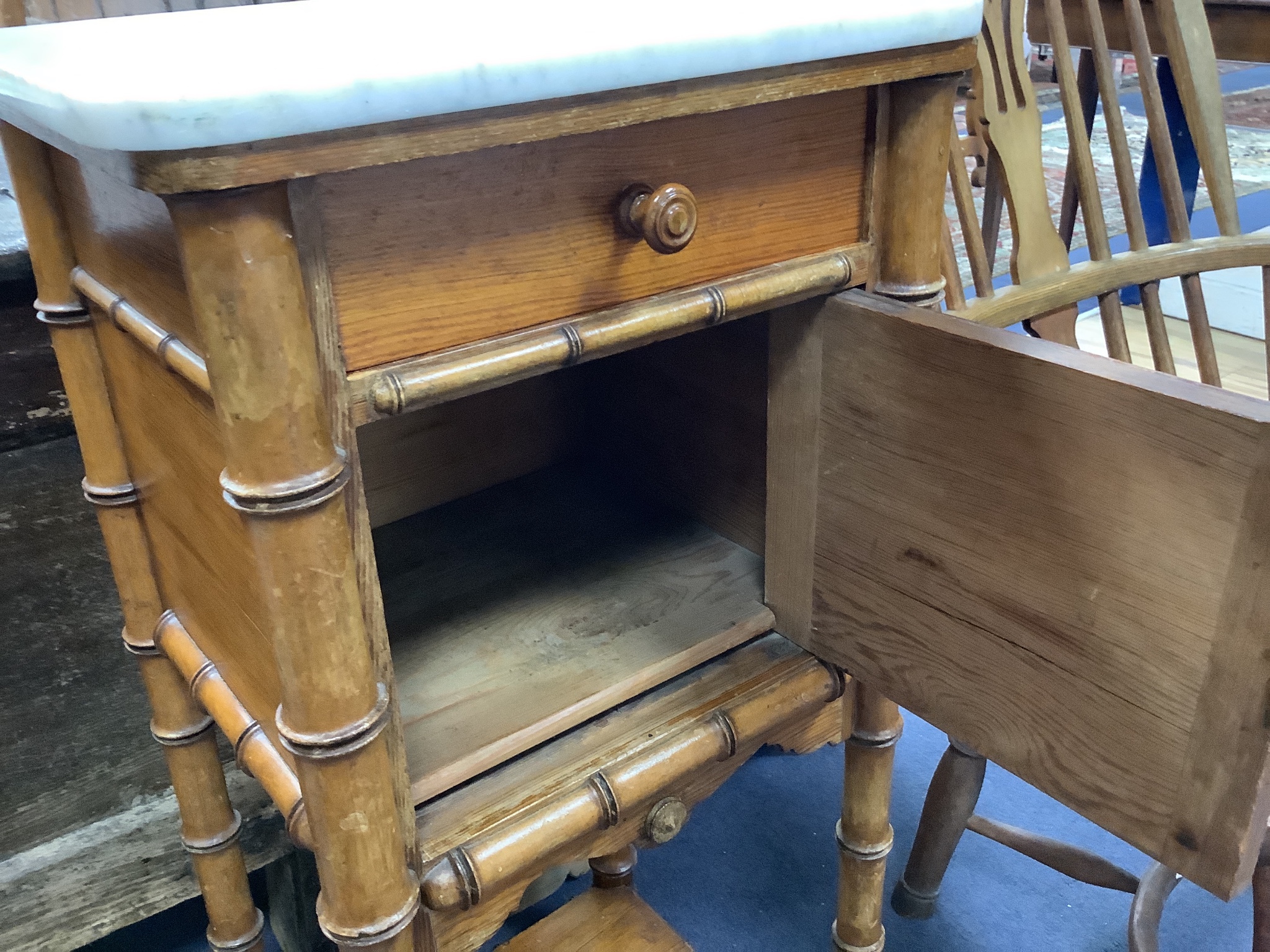 A Victorian pitch pine marble topped faux bamboo bedside cabinet, width 40cm, depth 36cm, height 85cm